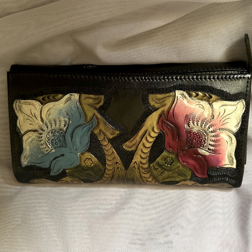 100% real leather wallets. Hand painted flowers.